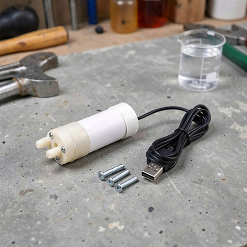 Portable Submersible Sump Pump With Built In Filter And Extended Drain Hose Heavy Duty Water Rig on workbench with tools.