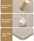 Close-up of anti fatigue kitchen floor mat showing utensil resistance, drop cushioning, and high-quality design in dark beige.