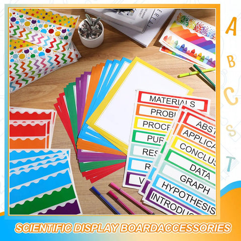 Rainbow Science Fair Board Kit With 60 Scalloped Borders, 24 Presentation Subtitles, And 6 Science Fair Title Stickers displayed on table
