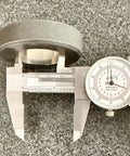 Six Inch Dial Caliper With Dual Metric And SAE Readout, Pro Grade Precision 0.001 Inch Resolution measuring a metal object