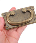 Hand holding Four Pack Vintage Drawer Pull Handles For Cabinets, Dressers, Wardrobes, And Vanities, Dope Retro Cabinet Hardware