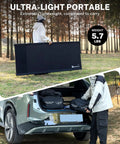 Person carrying Extra Wide 31.5 Inch Camping Cot Ultralight Folding Bed For Adults Portable fitting into car trunk