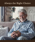 Elderly man in light blue shirt using a smartphone while sitting on a couch in a cozy living room.