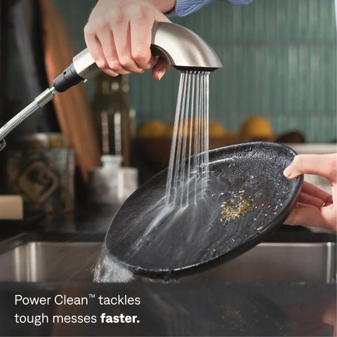 No Fuss Fix With Badass Power Clean Spray And Slick Spot Resist Stainless Finish For Kitchen Or Laundry Sink Quick Connect Tool Free Mount Heavy Duty One Handle Pullout Faucet Setup with water spray on a plate.