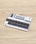 Straight Up Killer 2 Pack 5S Battery Management System 100A BMS Circuit Board with chips on a wooden surface.