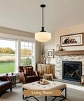 puncoll 13.8‘’ Vintage Milk Glass Pendant Light Kitchen Island hanging in a cozy living room above a plush ottoman.