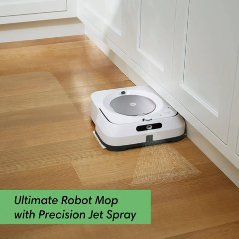 Smart Mapping Robotic Mop With WiFi Connectivity And Jet Spray For Multi Room Cleaning That Recharges And Resumes, Works With Alexa, White mop cleaning hardwood floor next to cabinets.