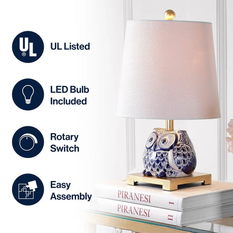 Blue White Ceramic Owl Table Lamp With Linen Shade Cozy Modern Farmhouse Nightstand Light For Bedroom Or Office LED Bulb Included Energy Efficient ETL Listed featuring owl design and hardback cotton drum shade on nightstand.