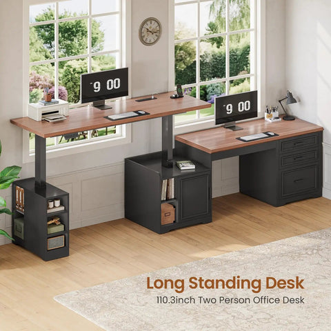 Farmhouse L Shaped Electric Standing Desk Boss Level Height Adjustable Sit To Stand Setup With 63 By 67 Inch Workspace Drawers And Shelves Built In Power Outlet Black in home office setting with two monitors and wooden floor.