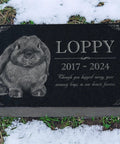 Custom Rabbit Memorial Stone For Outdoor Gardens And Gravesite with personal engraving on black granite in snow