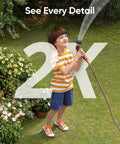 Child watering garden with hose, showcasing 2K image detail and clarity from Solar Powered Outdoor Security Cam With 2K Resolution No Subscriptions Built In 8GB Storage Wireless Setup Continuous Power From Sun HomeBase 3 Compatible Ideal For Yard Driveway Gate Surveillance.