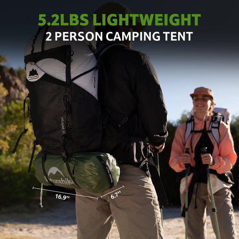 Hiker carrying Bleik-A 2 To 3 Person Camping Tent With Waterproof Double Layer on backpack, showing packed dimensions.