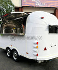 Premium Fully Equipped Food Trailer With Complete Mobile Kitchen Setup designed for street vendors, featuring a white exterior and stainless steel counter.