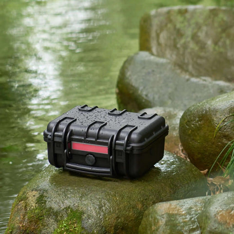 Kickass Hard Camera Case Featuring Smooth Side Handles And Custom Foam Dividers For Dslr Gear Transport on wet stones outdoors.