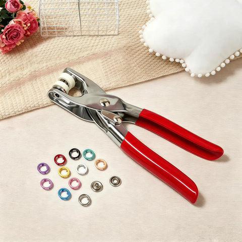 Straight Up Pro Level Snap Button Tool Kit With Tough Pliers Featuring 100 Sets Of 95Mm Metal Fasteners For Everyday Garment Repairs And Totally Sick DIY Projects with red handled pliers and assorted snap fasteners.