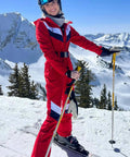 Woman wearing Women Dope Snow Ski Suit One Piece Jumpsuit Waterproof Windproof Warm Insulated Snowsuit with Heat Reflective Lining skiing.