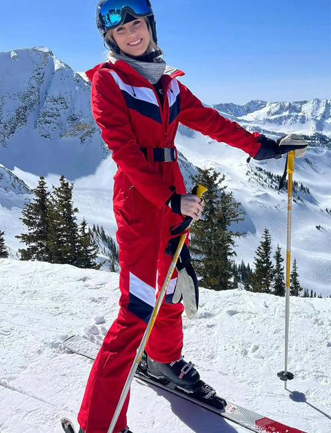 Woman wearing Women Dope Snow Ski Suit One Piece Jumpsuit Waterproof Windproof Warm Insulated Snowsuit with Heat Reflective Lining skiing.