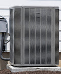 Outdoor air conditioning unit next to condenser with insulated pipes against white siding