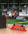 Built Like A Tank 12 Volt 250A Bus Bar And Power Distribution Block With Durable Cover For Marine Automotive Rv Solar Rig Featuring Fire Retardant Nylon Housing And M10 Terminals In Red Black Set, mounted next to a battery.