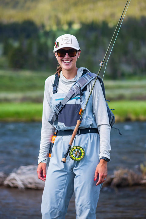 Person wearing fishing gear with Mag Grab Rod Rack Magnetic Fishing Rod Holder Black Quick-Access One-Hand Mount attached