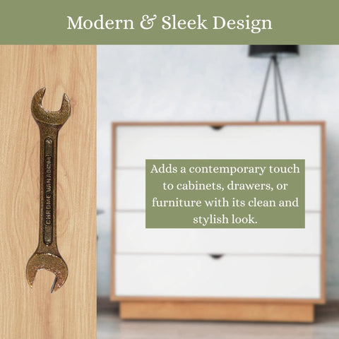 Antique Metal Wrench Drawer Pull For Cabinets And Tool Chests on wooden surface next to white chest of drawers.