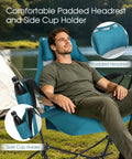 Man relaxing in Two Pack Hammock Camping Chairs With Stand And Storage Bag, blue chair with padded headrest and cup holder