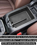 BMW X3 G01 2018-2024 and BMW X4 G02 2019-2025 center console organizer tray black in vehicle armrest view