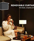 Woman relaxing under 10X10 Outdoor Gazebo With Double Roof For Extra Shade And Ventilation Curtains And Mesh Netting.