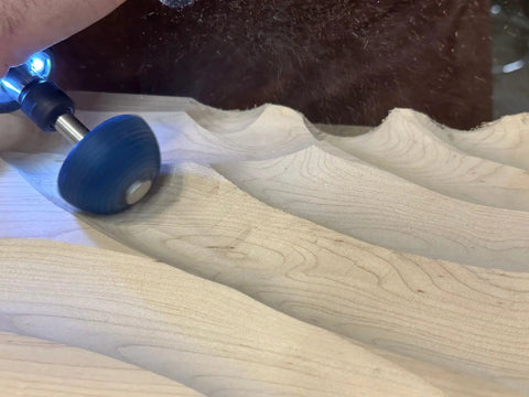 Badass Two Inch Tungsten Carbide Contour Wheel For Die Grinders, Coarse Grit wood carving in use on wood surface.