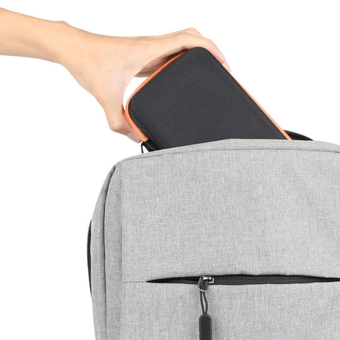 Person placing Hard Carrying Case Replacement for WORX WX081L WX082L ZipSnip into backpack, showcasing portability.