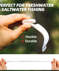 Person holding Curly Tail Worm Lures Soft Realistic Wavy Tail Bait Swimbaits For Saltwater And Freshwater Fishing Killer For Bass Trout Crappie And More 6 Inch White 20 Pack showcasing flexibility and durability.