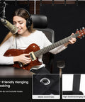 Heavy Duty Memory Foam Sound Dampening Blanket With Steel Grommets For Wall Hanging and Street Tested Noise Blocking Acoustic Panels in a home studio with a musician.