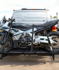 Four Pack Heavy Duty Black Ratchet Straps One Inch By Fifteen Feet securing motorcycle on a pickup truck ramp.