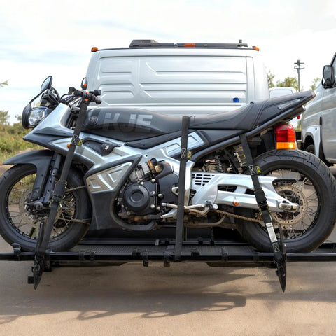 Four Pack Heavy Duty Black Ratchet Straps One Inch By Fifteen Feet securing motorcycle on a pickup truck ramp.
