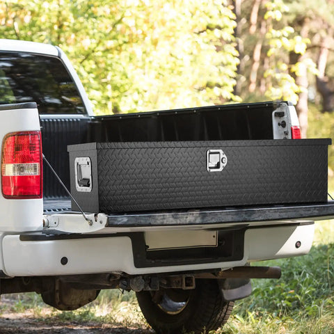 Road Ready Heavy Duty Aluminum Truck Bed Toolbox Featuring Diamond Plate Shield And Tamper Proof Latching For Rough Daily Runs And Tailgate Chasing 48 Inch Black Storage Case in truck bed.