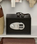 Steel Security Safe With Electronic Keypad And Emergency Override Keys, black safe on shelf with glasses on top, 0.5 cubic feet