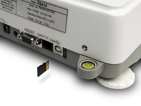 Cap Torque Gauge With NIST Traceable Certificate 100 Lbf Inch And 0.1 Lbf Inch High Res Clockwise And Counter Clockwise Testing Built In Wireless Data Capture USB RS232 MicroSD Seven Inch Diameter Sample 1000 Hz Readouts rear USB RS232C ports, microSD slot, and level on white housing