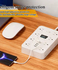 Total Game Changer Flat Power Strip With Eleven AC Outlets And Three Smart USB Chargers on a desk charging a phone.