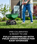Person using Turf Builder EdgeGuard Mini Broadcast Spreader For Lawns, Spreads Grass Seed Fertilizer And Salt Like A Pro