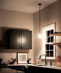 Hendrik 1-Light Mini Pendant with Brushed Nickel Finish and Satin Etched Cased Opal Glass Shade lighting a modern kitchen.