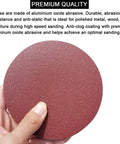 Hand holding a 5 Inch PSA Sanding Disc with aluminum oxide grain for DA sander, part of 5 Inch PSA Sanding Discs Set With 60 Pieces Ten Each Of 80 100 120 180 240 And 400 Grit Self Adhesive Sticky Back For DA Sander Great For Car Paint Prep Woodworking And Metal Shaping