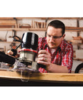 Man using Universal Dust Free Router Hood for Portable Routers Keeps Your Workbench Clean by Containing Router Dust