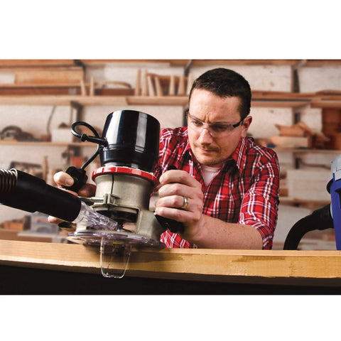 Man using Universal Dust Free Router Hood for Portable Routers Keeps Your Workbench Clean by Containing Router Dust