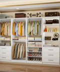 Slick Modular Closet System That Gives Your Bedroom A Major Wardrobe Flex Featuring Six Mega Drawers Eight Stretch Hanging Rods And Adjustable Shelving Towers White Four Piece Kit with organized clothing and shoes.