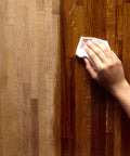Hand applying Deep Penetrating Food Grade Butcher Block Conditioner For Hardwood And Bamboo Surfaces That Revitalizes Wood