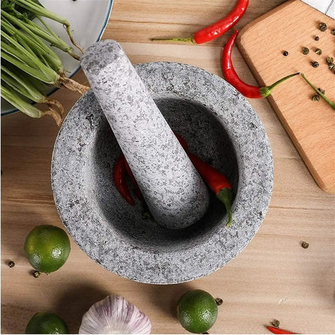 Unpolished Granite Mortar And Pestle Set With Silicone Lid 2 Cup Capacity Garlic Peeler Non Slip Pad 5.5 Inch Spice Grinder on table