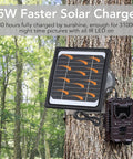 5W 12V Trail Camera Solar Panel Charger Kit With 5200mAh Battery attached to tree in forest for game cameras