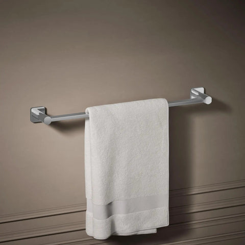 Parallel 24-Inch Towel Bar In Polished Chrome, mounted on wall with white towel, showing circular-in-square design, sleek modern accessory.