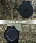 Total Game Changer Camp Toilet Seat With Ultra Plush Cushion And Secure Swivel Lid Fits Standard 5 Gallon Bucket Comes Fully Equipped With Sturdy Tp Rack For Trail Adventures And Weekend Retreats, shown in hand for portability.