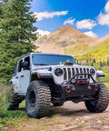 Off-road vehicle equipped with heavy duty D ring shackles 58000 lbs capacity tow shackle with seven eighth inch pin and washers.